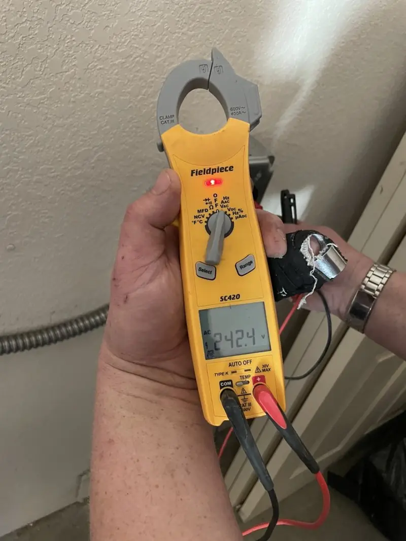 Voltage testing with clamp meter during Electrical Installation Services in Wyboo